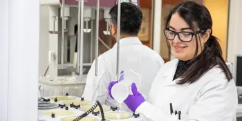 chemists with dissolution bath